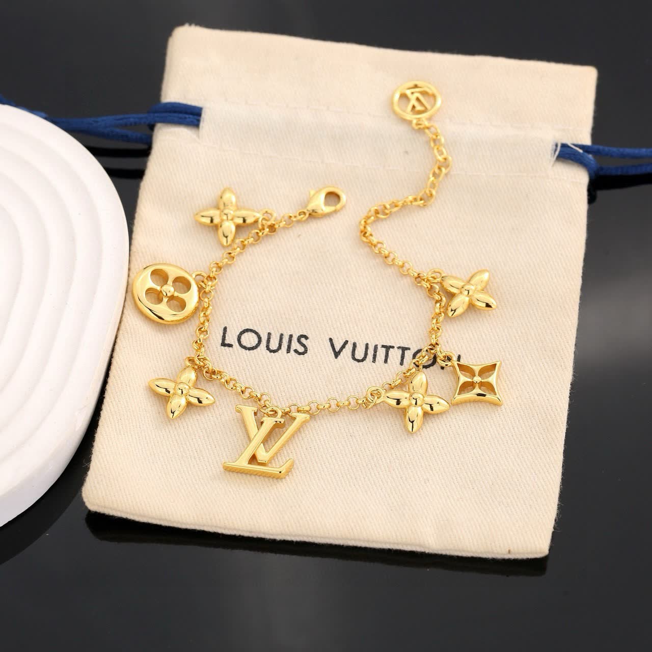 Louis Vuitton Gold Tone Bracelet with Charms